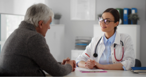 A patient asking their provider questions about an upright MRI.
