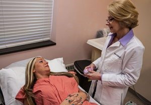 doctor and patient in a room having a discussion
