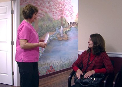 technician and patient in a waiting room