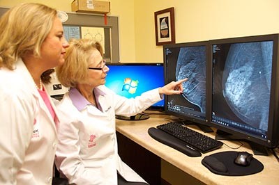 two doctors looking at computer screens